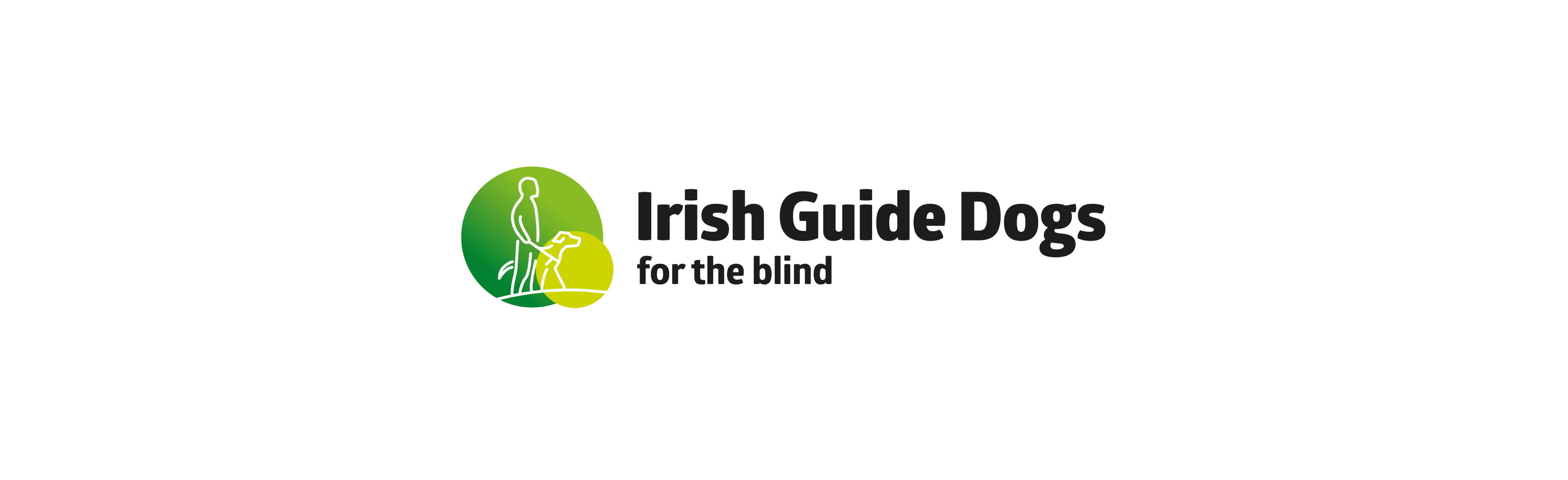 The Irish Guide Dogs for the Blind logo features a visually impaired person and a guide dog within two overlapping circles. The person, represented in a darker green, is holding the leash of the guide dog, depicted in a lighter green.